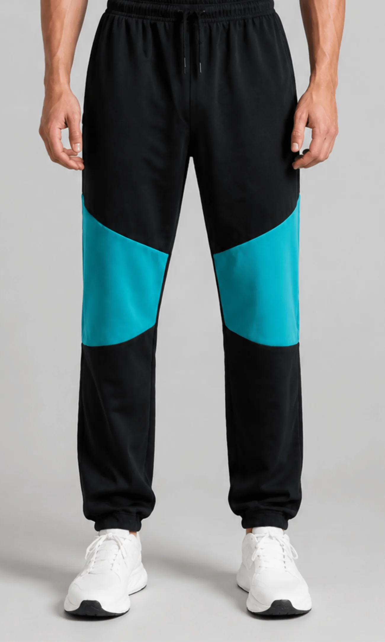 Model wearing the Vega Noir Colorblock Tapered Joggers